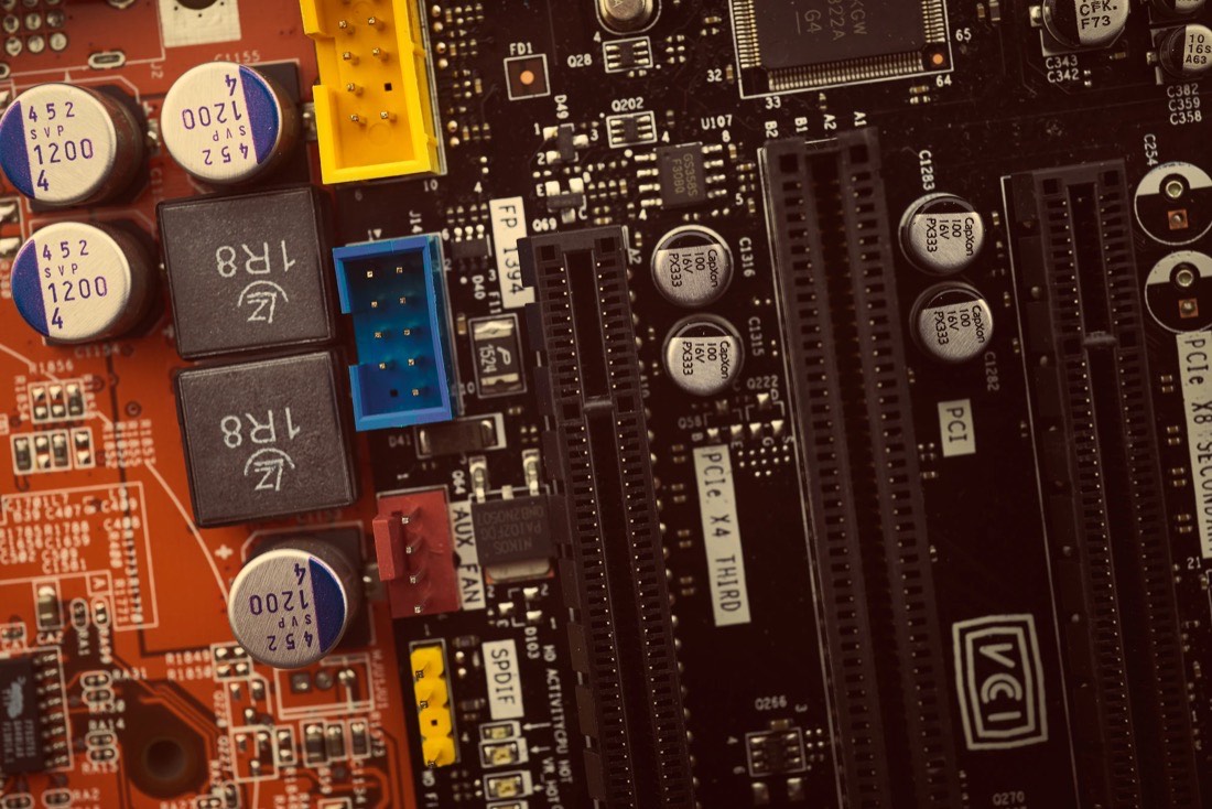 Circuit board with dozens of different components, a metaphor for the plugin stack of a WordPress site
