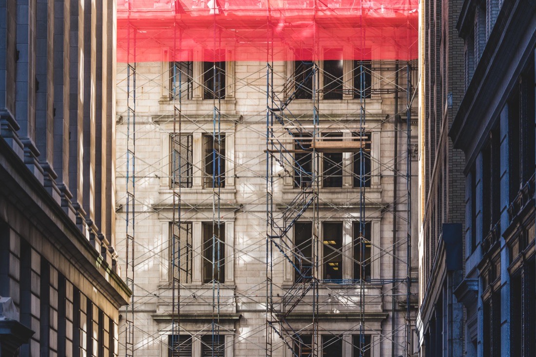 Historic building covered in scaffolding during works, a metaphor for a site migration